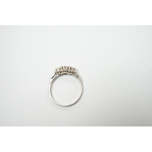 1900 - A white metal, stamped plat and three stone diamond set ring, size M/N, gross weight 2.8 grams, with... 