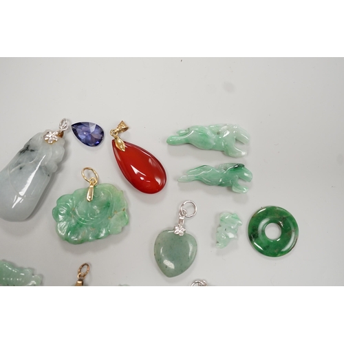 1904 - Twelve assorted carved jadeite items including five pendants, largest 40mm, a 14k mounted carnelian ... 