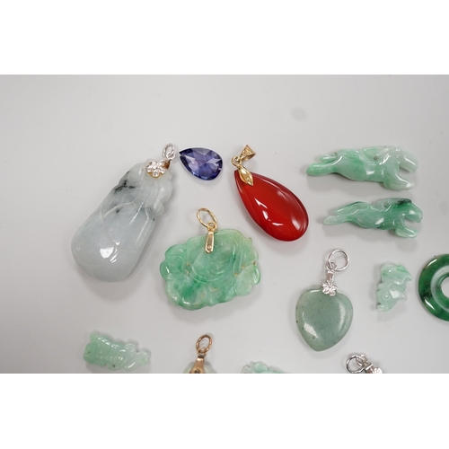 1904 - Twelve assorted carved jadeite items including five pendants, largest 40mm, a 14k mounted carnelian ... 