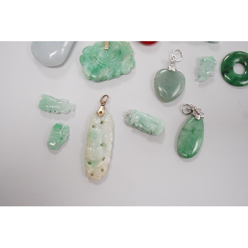 1904 - Twelve assorted carved jadeite items including five pendants, largest 40mm, a 14k mounted carnelian ... 