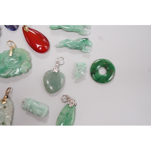 1904 - Twelve assorted carved jadeite items including five pendants, largest 40mm, a 14k mounted carnelian ... 