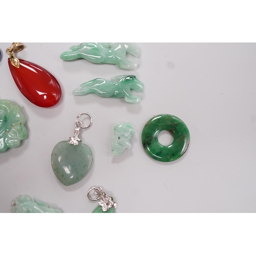 1904 - Twelve assorted carved jadeite items including five pendants, largest 40mm, a 14k mounted carnelian ... 