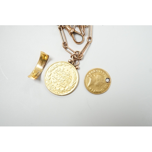 1911 - A Turkish 100 Karush gold coin, now mounted on a 9ct albert, chain 35cm, a gold one third guinea (wo... 