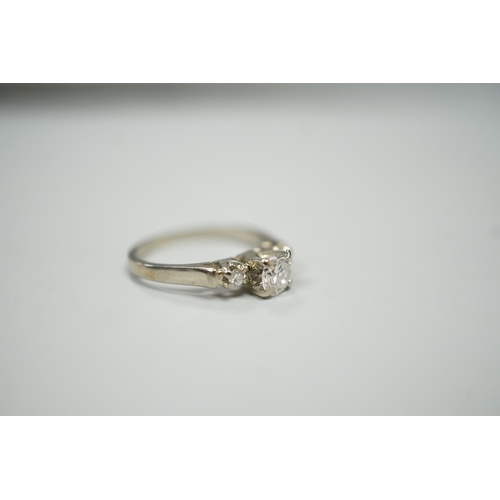 1914 - A Canadian Birks 18k white metal and single stone diamond ring, with diamond set shoulders, size H, ... 