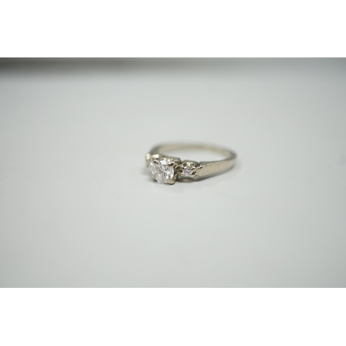 1914 - A Canadian Birks 18k white metal and single stone diamond ring, with diamond set shoulders, size H, ... 