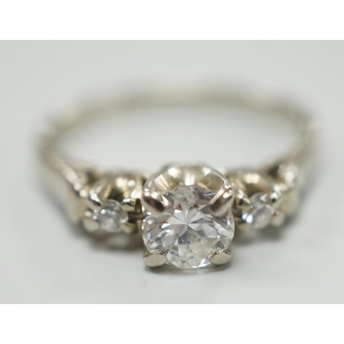 1914 - A Canadian Birks 18k white metal and single stone diamond ring, with diamond set shoulders, size H, ... 