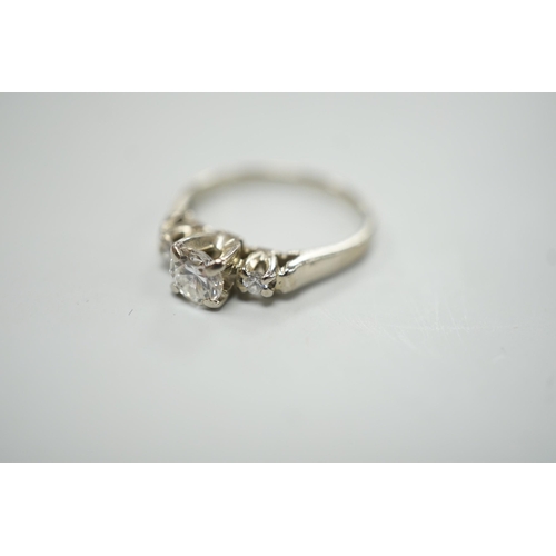 1914 - A Canadian Birks 18k white metal and single stone diamond ring, with diamond set shoulders, size H, ... 