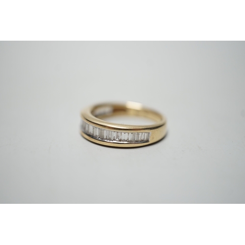 1915 - A modern 14k yellow metal and graduated  baguette and trapeze cut diamond set half eternity ring, si... 