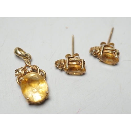 1917 - A modern 14k, citrine and diamond chip set pendant, 15mm and a pair of matching ear studs, gross wei... 