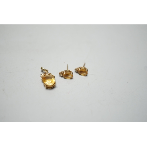 1917 - A modern 14k, citrine and diamond chip set pendant, 15mm and a pair of matching ear studs, gross wei... 