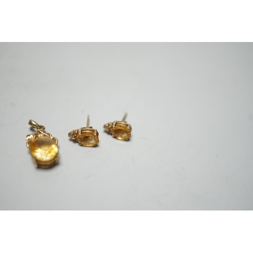 1917 - A modern 14k, citrine and diamond chip set pendant, 15mm and a pair of matching ear studs, gross wei... 