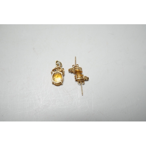 1917 - A modern 14k, citrine and diamond chip set pendant, 15mm and a pair of matching ear studs, gross wei... 