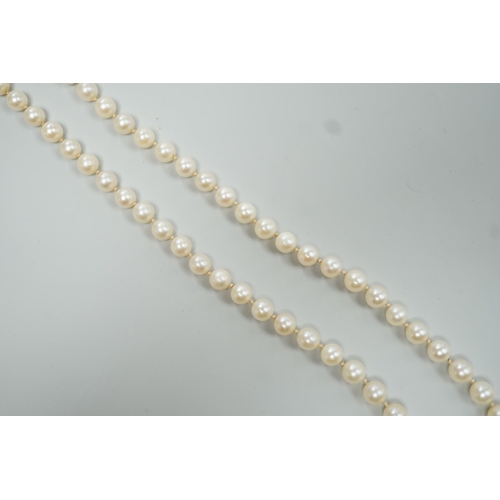 1924 - A Mikimoto single strand cultured pearl necklace, with sterling clasp, 48cm, with Mikimoto pouch.... 