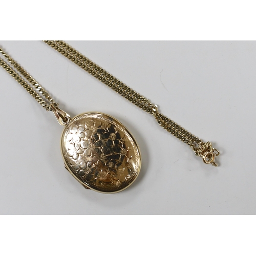 1928 - A modern 9ct gold oval locket, 33mm, on a 9ct gold chain, gross weight 16 grams.