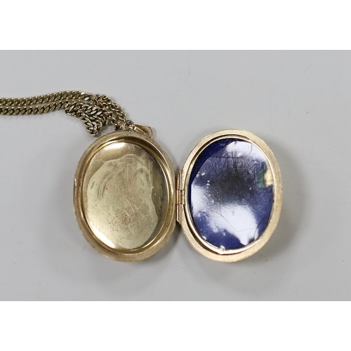 1928 - A modern 9ct gold oval locket, 33mm, on a 9ct gold chain, gross weight 16 grams.