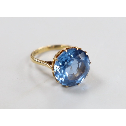 1936 - An 10k and blue paste? set ring, size K/L, gross weight 7 grams.