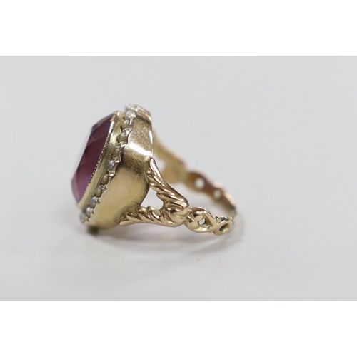 1937 - A Victorian style yellow metal, amethyst and seed pearl set oval dress ring, size N/O, gross weight ... 