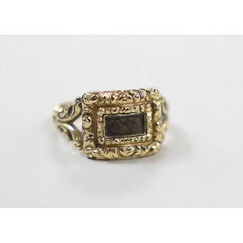 1938 - A George IV yellow metal and plaited hair set mourning ring, the ring head verso engraved 'In Memory... 