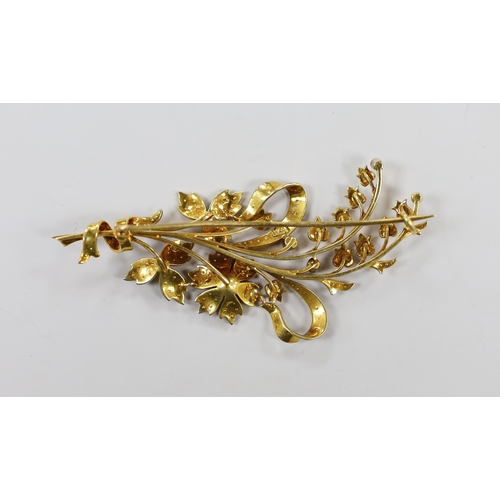 1942 - An Edwardian 15ct and seed pearl set floral spray brooch, 76mm, gross weight 13.5 grams.