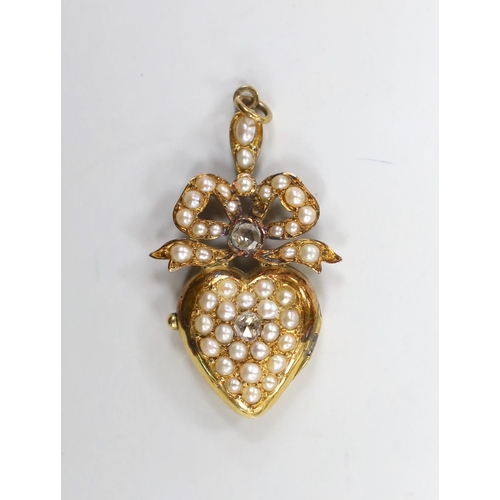 1943 - An Edwardian yellow metal, rose cut diamond and split pearl cluster set heart shaped locket pendant,... 