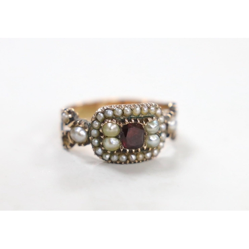 1949 - A 19th century yellow metal, foil backed? garnet and split pearl set ring (repair), size O/P, gross ... 