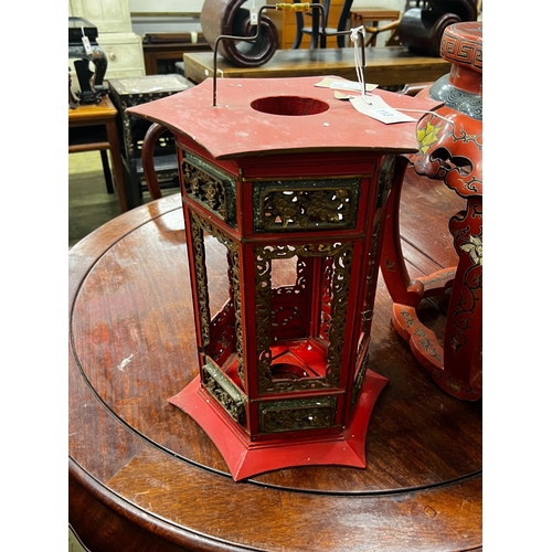 113 - A Chinese red lacquer circular vase stand, diameter 44cm, height 47cm together with a similar Chines... 