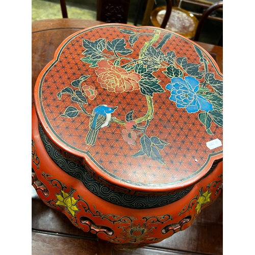 113 - A Chinese red lacquer circular vase stand, diameter 44cm, height 47cm together with a similar Chines... 