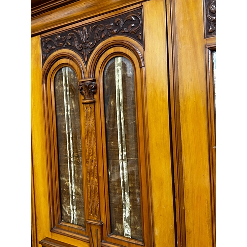 142 - A late Victorian satin walnut and burr elm two door mirrored wardrobe, width 130cm, depth 50cm, heig... 