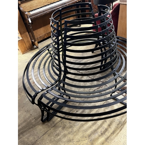 148 - A painted wrought iron two section circular tree seat, diameter 150cm, height 100cm, minimum interna... 