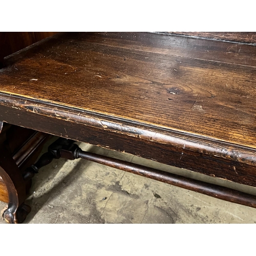 149 - A Portuguese carved oak and fruitwood settle