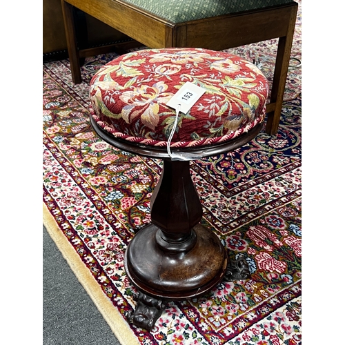 153 - An early Victorian mahogany revolving piano stool