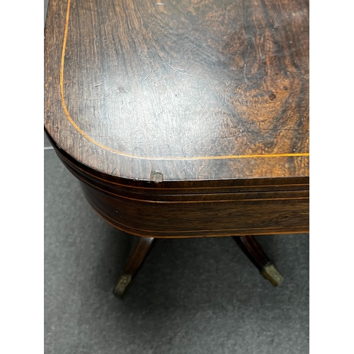 157 - A Regency inlaid rosewood D shaped folding card table, width 86cm, depth 44cm, height 74cm