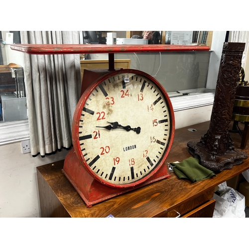 183 - An industrial style painted metal clock console table modelled as a set of scales, width 102cm, dept... 