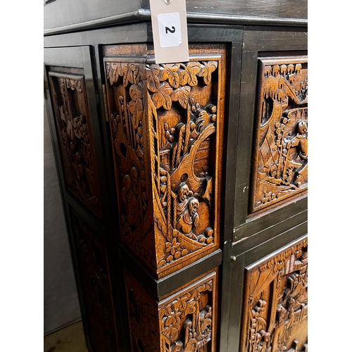 2 - A Chinese carved hinged top cocktail cabinet with mirrored interior, width 111cm, depth 46cm, height... 