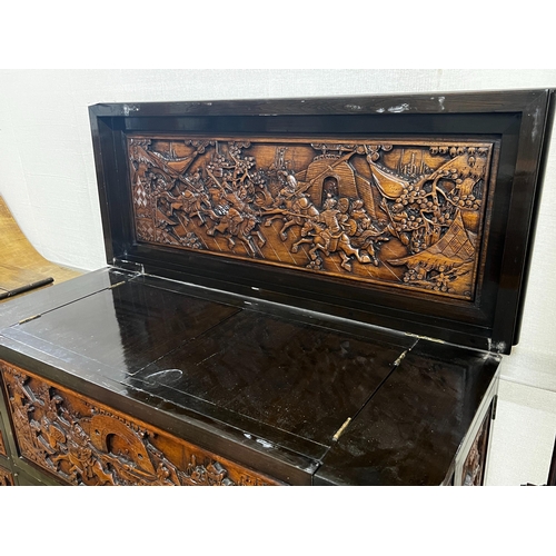 2 - A Chinese carved hinged top cocktail cabinet with mirrored interior, width 111cm, depth 46cm, height... 