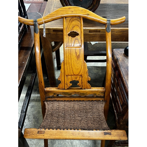 23 - A Chinese elm folding hunting chair, height 105cm