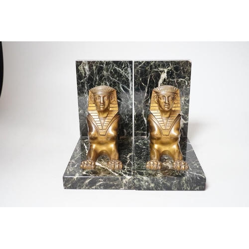 251 - A pair of Art Deco bronze and serpentine 'sphinx' bookends, 17cms wide x 15.5cms high