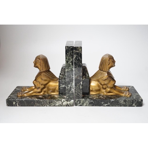 251 - A pair of Art Deco bronze and serpentine 'sphinx' bookends, 17cms wide x 15.5cms high