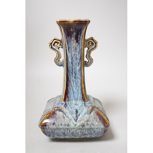 256 - A Chinese Shiwan two handled vase, 23cms high