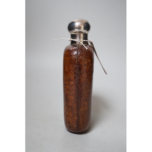 258 - A large Dixon's crocodile skin covered hip flask, early 20th century,  20cms high