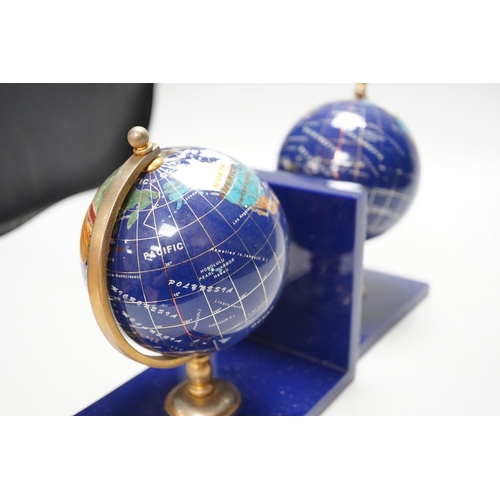 264 - A pair of hardstone mounted acrylic terrestrial globe bookends. 18cm tall