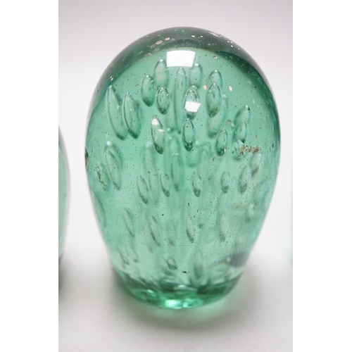 265 - Four 19th century green glass dumps, one floral, tallest 16cms high