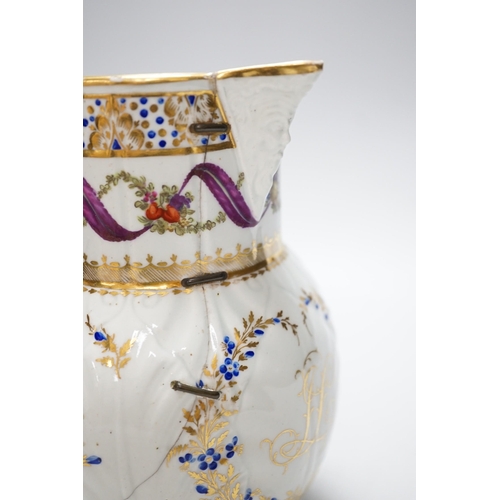 266 - An 18th century Caughley very rare polychrome mask jug, elaboratley painted and gilded with two init... 