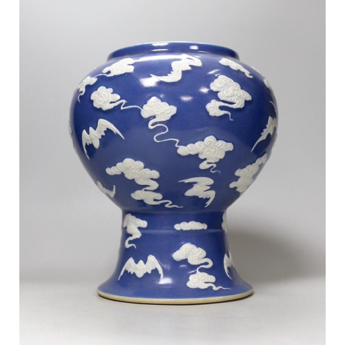 286 - A Chinese slip-decorated blue glazed 'bats' vase 24cm