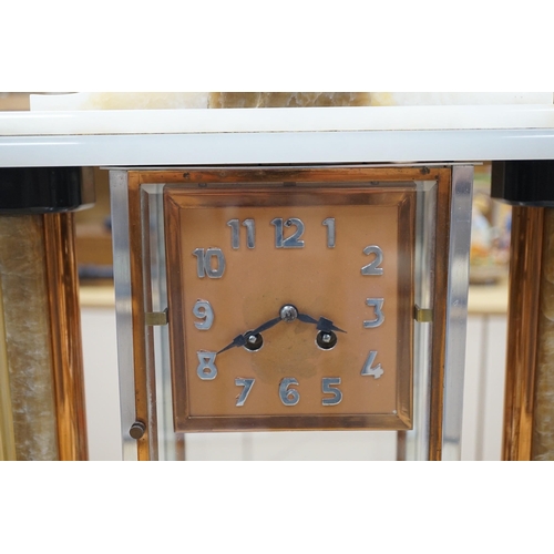 289 - An Art Deco chrome, copper, brass and alabaster four glass mantel clock, 54cms wide