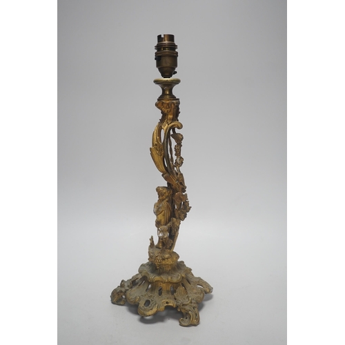 323 - A 19th century French rococo style ormolu candlestick, converted to table lamp, 39cm tall