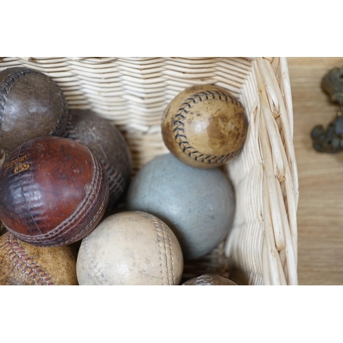 324 - A collection of leather cricket and sporting balls