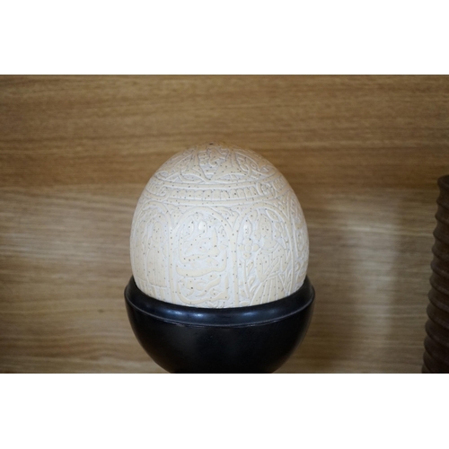 325 - A quantity of African and other carvings including an ostrich egg