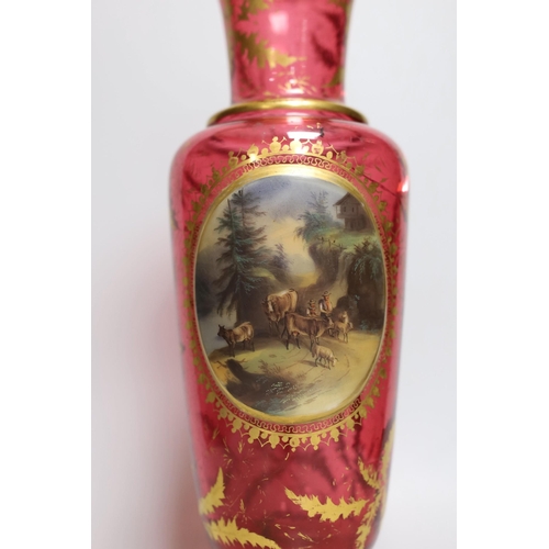 326 - A 19th century Bohemian overlaid cranberry glass vase, 37cm tall