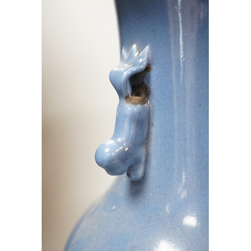 331 - A Chinese slip-decorated blue glazed vase, 40cm